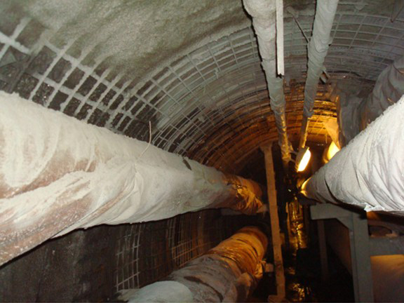 A concrete mixture (shotcrete) was then blown onto the walls and ceiing of the tunnel